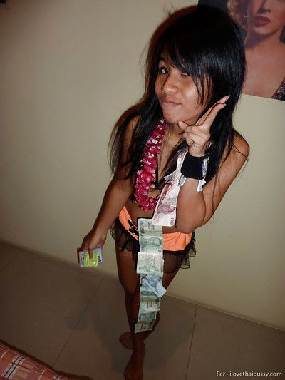Petite Thai bar girl showing off her shaved pussy for money
