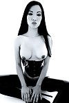Asian Jade Vixen in thigh high latex boots and corset makes no secret of her tits and snatch