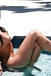 Wet asian brunette babe Valentina Vaughn in sexy bikini exposes her fine body in the pool
