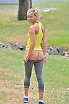 Appealing fairy girl shedding spandex pants and dominant to pose nude in public park