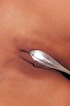 Regina Ice inserts silver spoon in her shiny on top pussy afterward losing her diminutive white strings