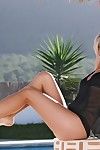 Baring her sexy sheer ebony top beautiful blond Iveta Vale plays uncovered by the swimming pool