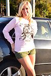 Hilarious and brave blonde babe is taking off her panties in the car outdoors