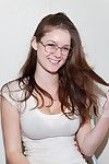 Adorable teen with sexy glasses enjoys posing naughty and shaking her big tits