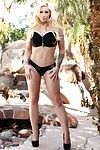 Blonde pornstar Candy Manson with perfect huge boobs loves posing naked outdoors