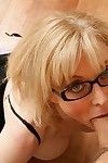 Leggy blonde milf Nina Hartley in glasses poses in lingerie then takes care of thick solid cock