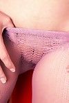 Big titted brunette Bryci in red dress pulls down her violet mesh pantyhose