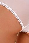 Slender blonde babe Crystal Klein in black mini skirt takes off her white transparent undies