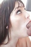 Busty brunette Holly Michaels giving large penis ball licking BJ on knees