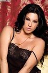 Glamorous black haired babe Roxy DeVille strips down to her bare skin but leaves her high heels on