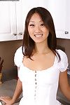 Oriental cutie Evelyn Lin with shaved spot spreads her slim legs with no shame in the kitchen