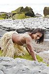Beach babe Karyn flashing shaved pussy and bodybuilder physique outdoors
