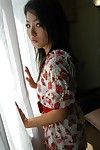 Oriental amateur Nao Miyazaki undressing and exposing her vagina in close up