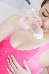 Raunchy Chinese whore Ryu Enami is oiling her untamed body in pink swimsuit and then riding fucker\'s penis with wet crack
