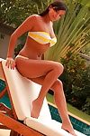 Yellow with an increment of white striped bikini is perfection on young model Sasha Cane